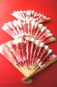 Toddler activity decorating fans for Chinese New Year.