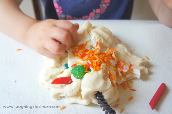 Using a variety of coloured pasta and play dough