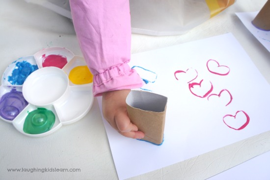 learning shapes with cardboard stamps