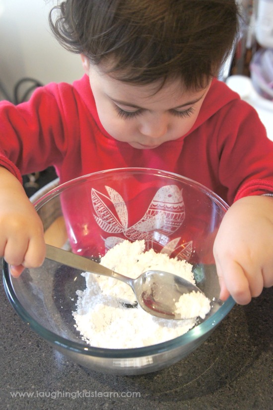 Toddler making sherbet for science activity