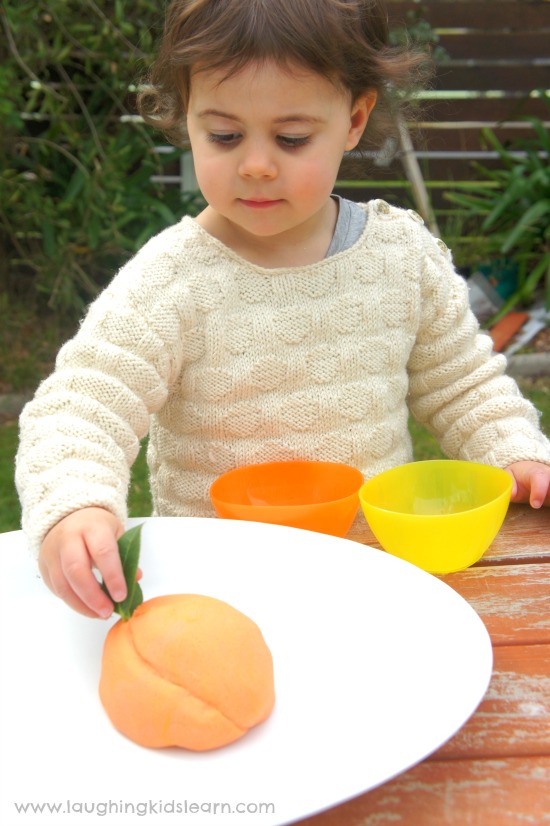 playing with peach scented play dough