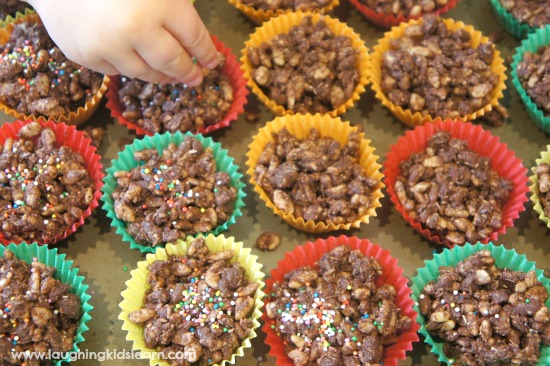 adding coloured sprinkles to treats