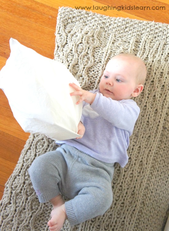 Baby playing with kick bag