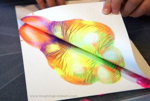 Pressing paint to learn symmetry with kids