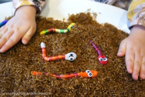 Digging for pipe cleaner worms. Fun activity in pretend mud.