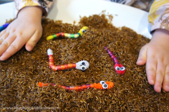 Digging for pipe cleaner worms. Fun activity in pretend mud.
