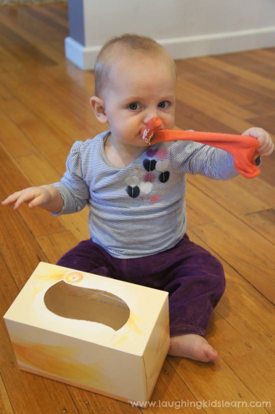 Baby finding objects in box