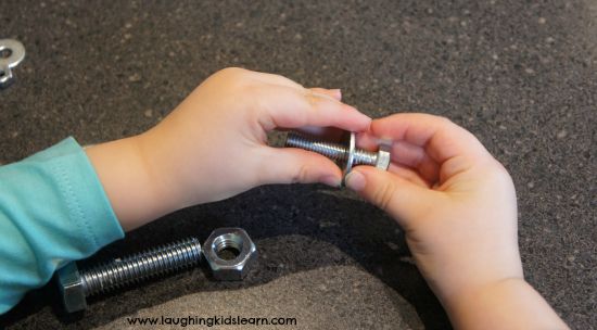Developing fine motor skills with nuts and bolts