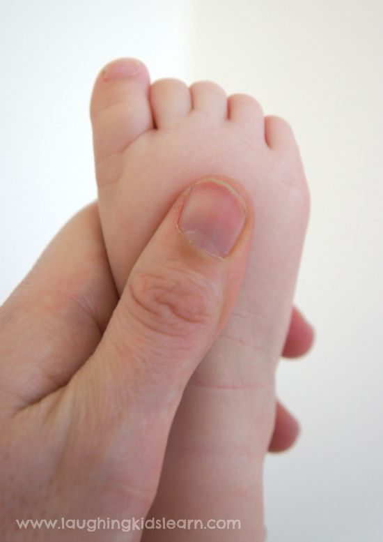 Massaging baby's feet