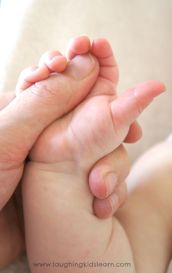 Massaging baby's hand
