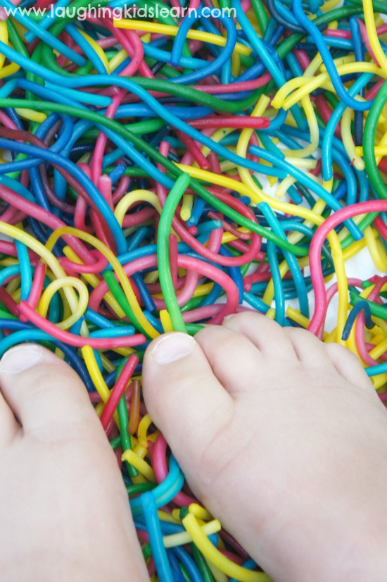 Using feet in spaghetti play for sensory learning