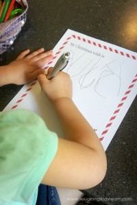 Writing a letter to Santa on free Christmas printable