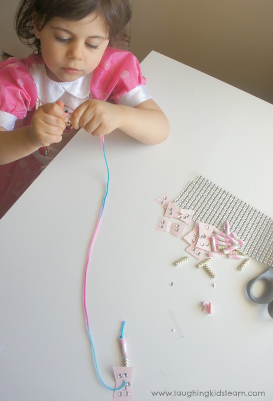 Using cut straws and wool for threading activity