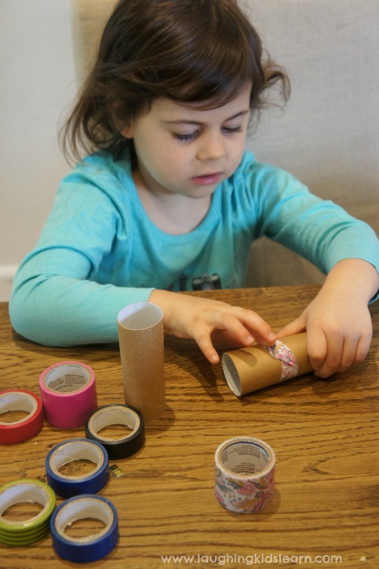 Using wash tape on toilet rolls to make simple musical instrument shakers.