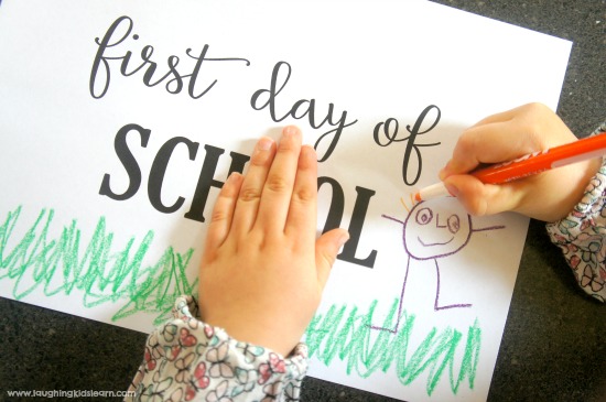 Decorating school photo sign for first day of school