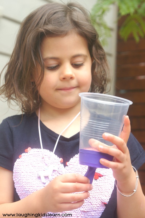 Pom Pom Popper or Shooter fun using plastic cup and balloon