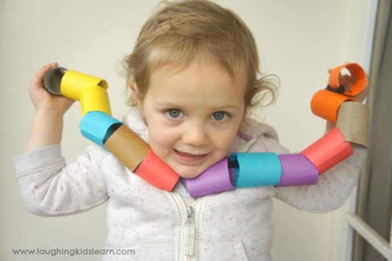 Threading activity for toddlers using cardboard beads