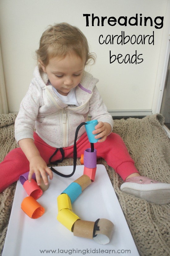 Threading activity for toddlers using large cardboard beads