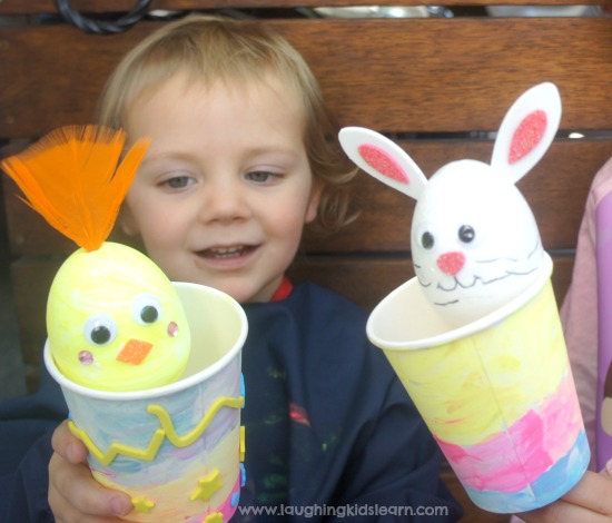playing with pop up toys for easter. Fun Easter craft for kids