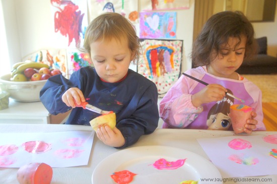 painting potato stamps kids can make and use to make wrapping paper or decorations
