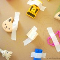sticking toys down with sticky tape