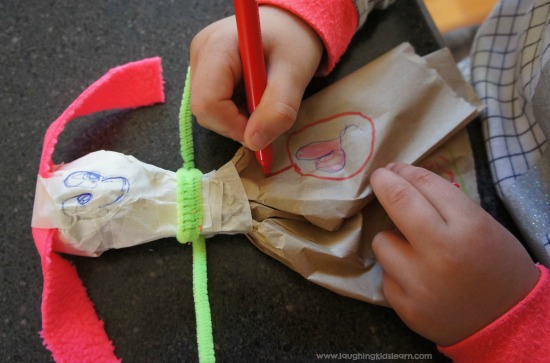 Making a DIY doll using paper bag and rock