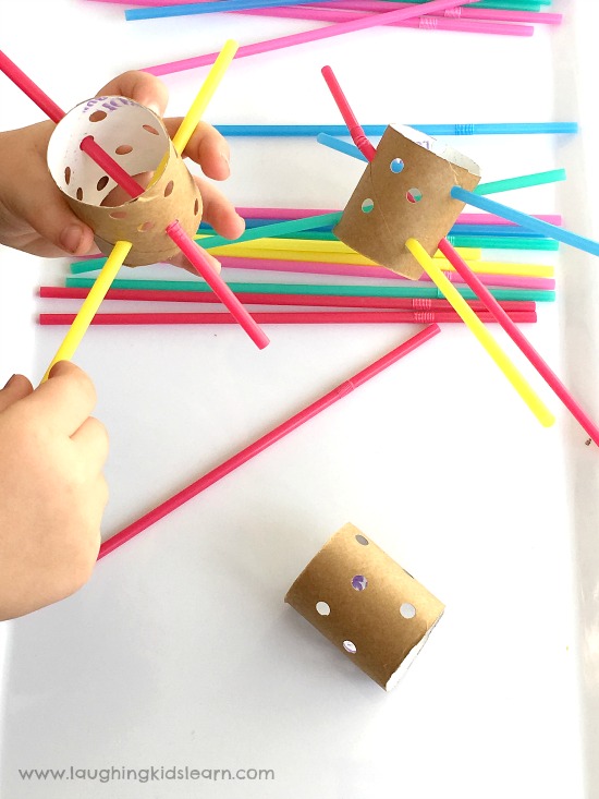 kids have fun threading straws and cardboard tubes for fine motor
