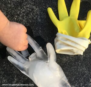 Frozen hands science experiment for kids to do outdoors.