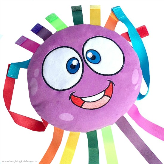 Octi the plush octopus toy for developing find motor skills and more.