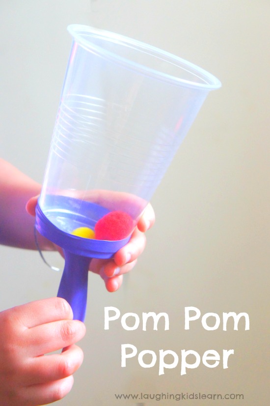pompom science popper using a plastic cup and balloon. #simplescienceideas #diytoy 