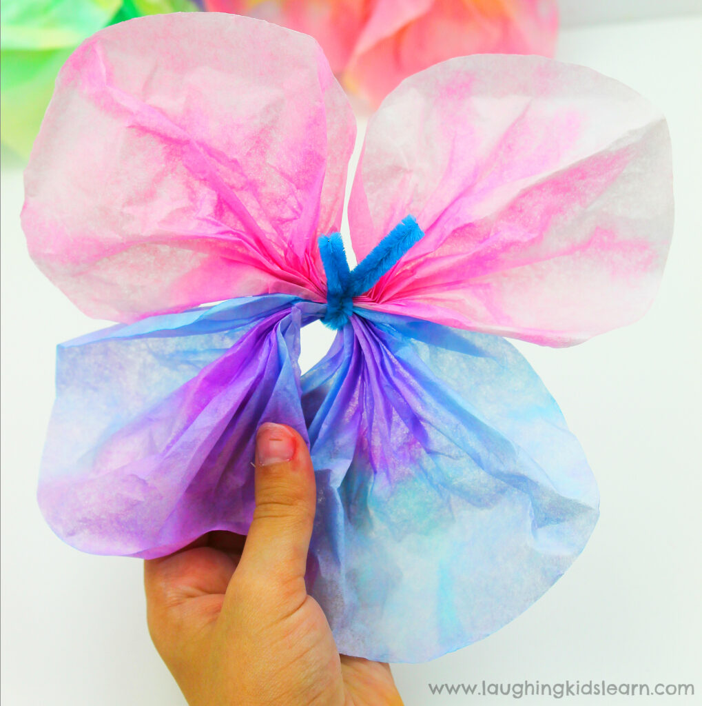 Simple and fun coffee filter butterfly craft for kids to try. This step by step guide will help you learn how to make coffee filter butterflies. #coffeefilter #coffeefiltercrafts #coffeefilterbutterflies #coffeefilterbutterflycrafts #pipecleaners #finemotor #finemotorskills #craftideasforkids #kbn #simplecraftideas #simplecraft #butterflies #butterflies #papercraft #waterpaints #waterpaintingwithkids #makeabutterfly #butterflycrafts #butterflycraftideas #rainforestcraft 