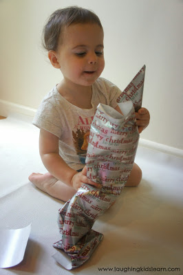 Invitation to explore Christmas wrapping paper and introduce the concept of area to kids
